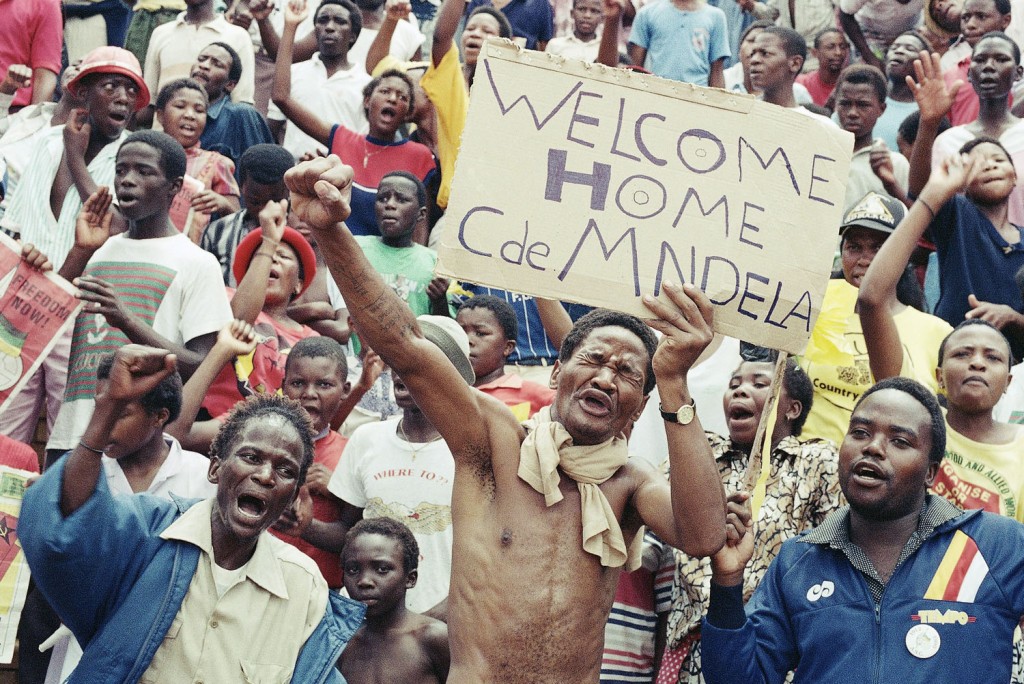 Jubilant A.N.C. supporters gathered at Jabulani Stadium, in Soweto, South Africa, to celebrate the release of Mandela, on February 11, 1990. Photograph by Raymond Preston/AP.