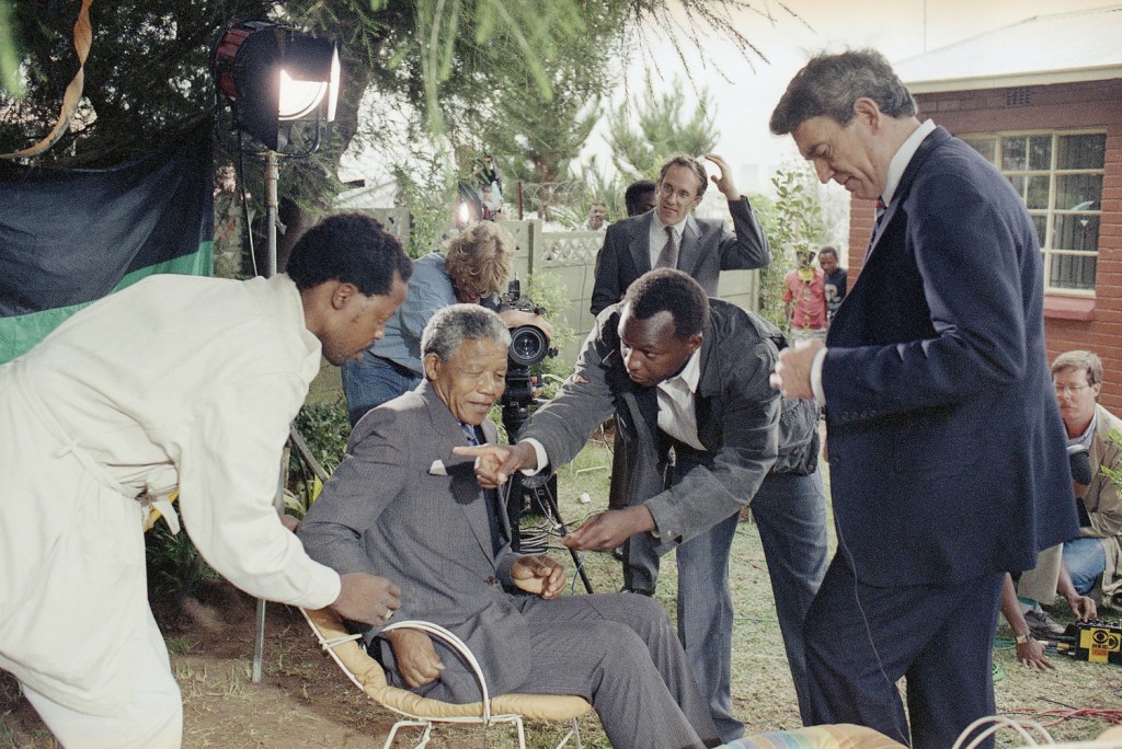 Mandela is wired for a television interview with the CBS anchorman Dan Rather, right, in the garden of his home in Soweto, on February 14, 1990, on his fourth day of freedom. Photograph by John Parkin/AP.
