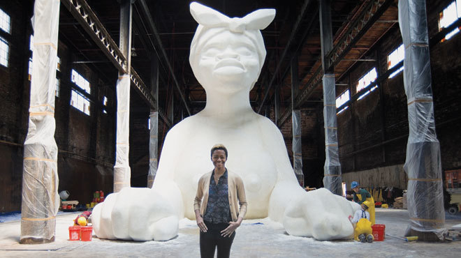 Karen Walker in front of her installation in progress at the Domino Sugar Factory in Brooklyn / Photograph: Alex Strada