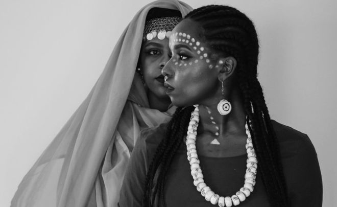 The government is seen as trying to suppress an African identity in Sudan / SATIR DESIGNS & ALFANJARYA