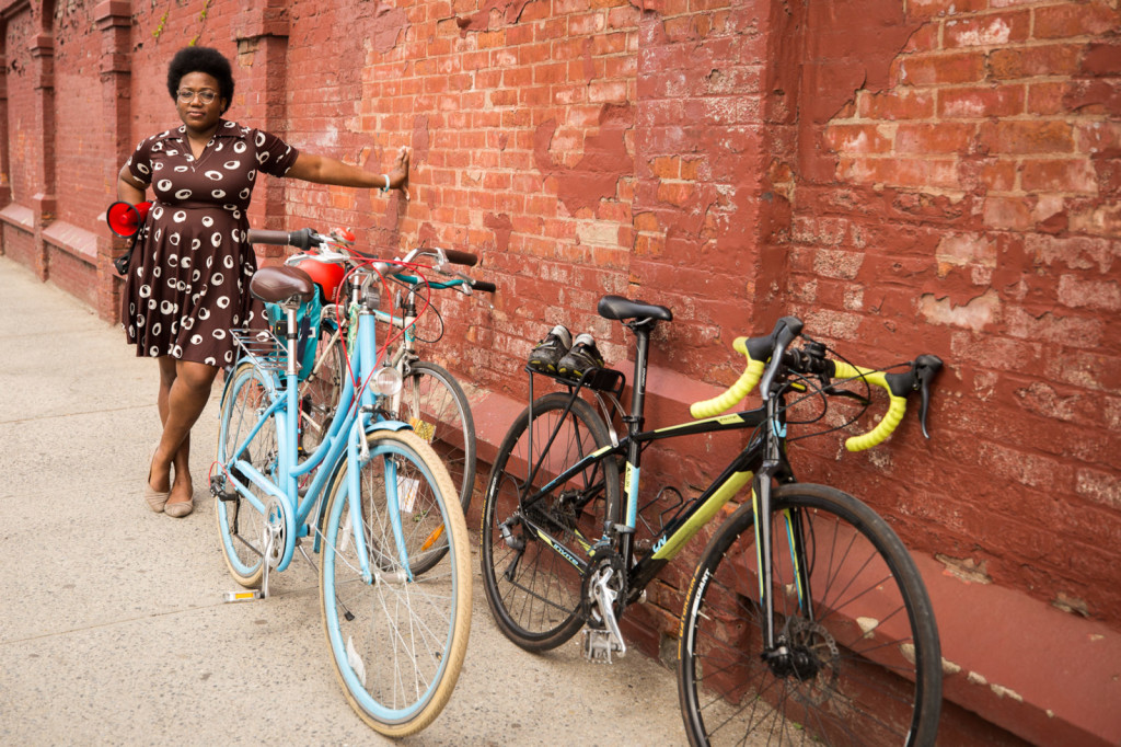 Courtney poses with her three bikes.